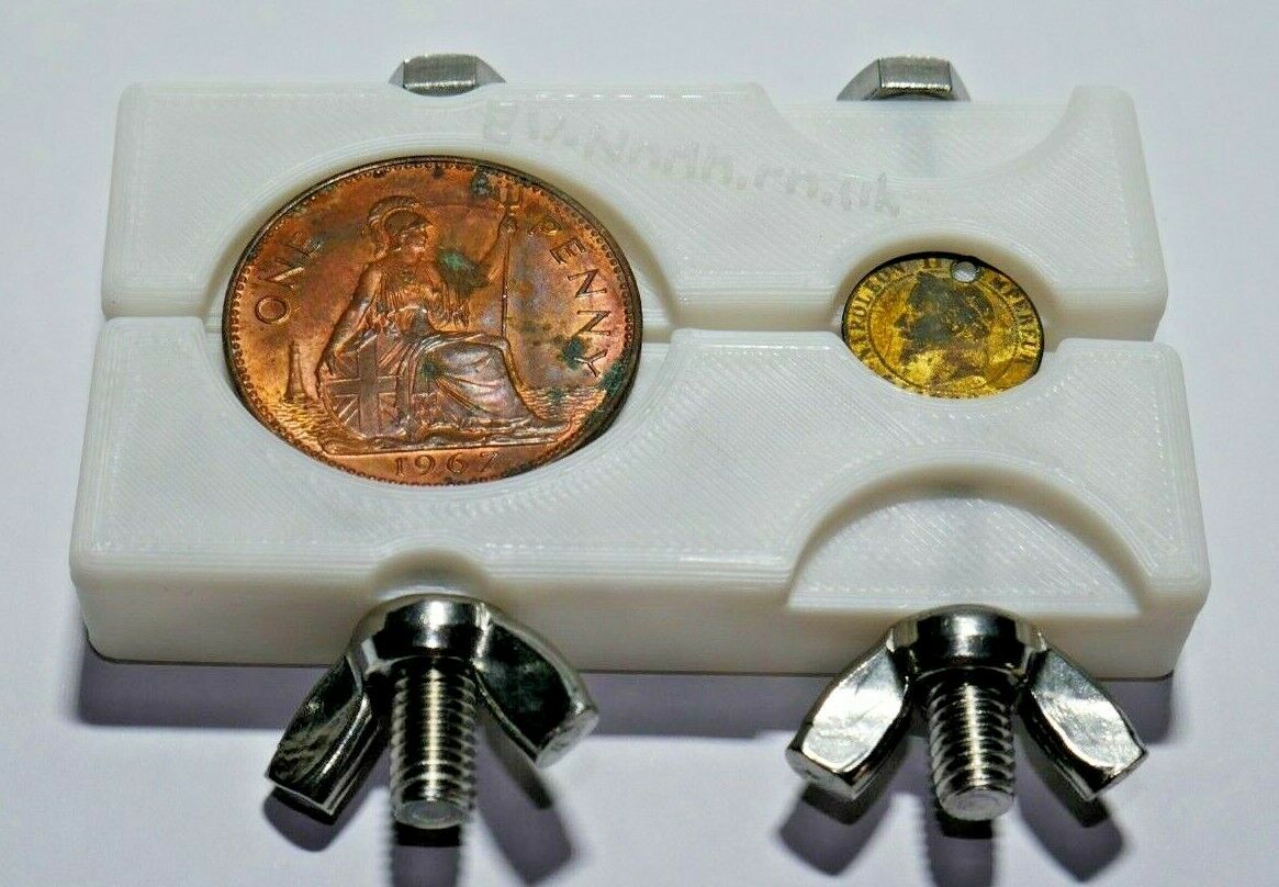 White Coin holding clamp / vice, for cleaning and inspecting coins.